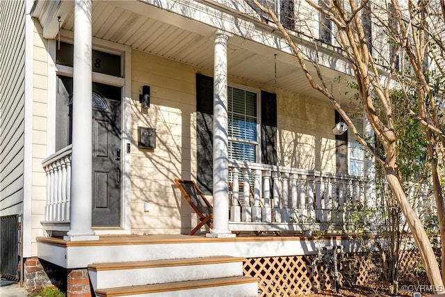 entrance to property with covered porch