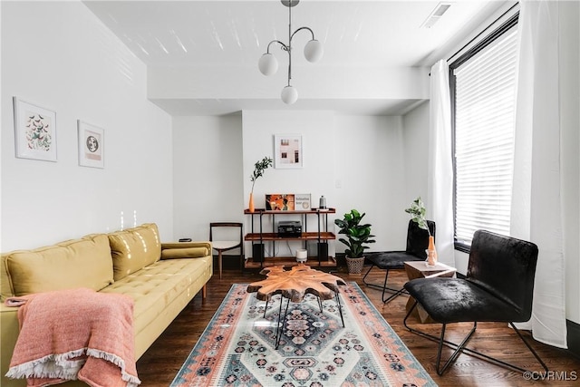 living room featuring dark hardwood / wood-style flooring and a wealth of natural light