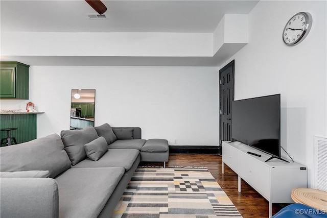 living room with dark hardwood / wood-style floors