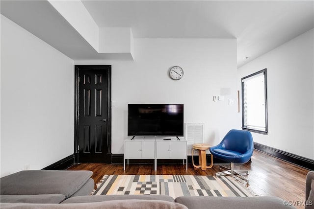 living room with dark hardwood / wood-style flooring