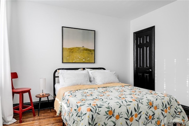 bedroom featuring hardwood / wood-style flooring