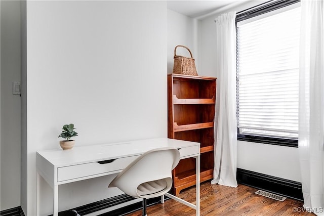 office featuring hardwood / wood-style floors and a wealth of natural light