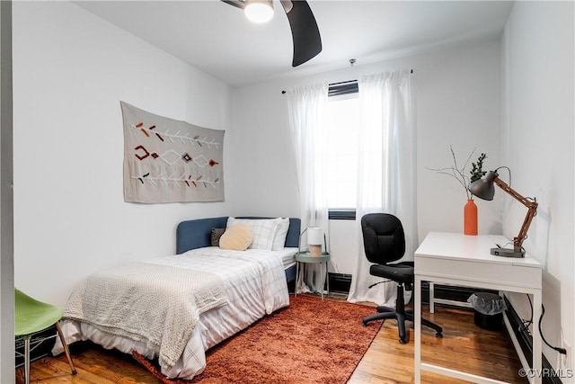 bedroom featuring ceiling fan and hardwood / wood-style floors