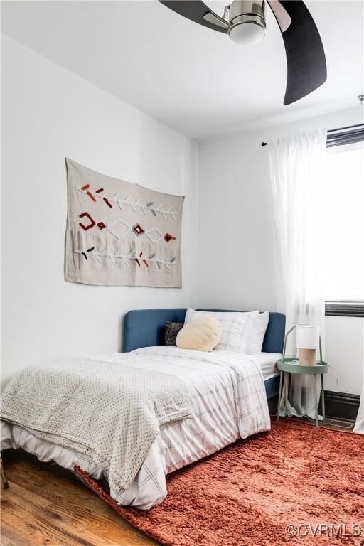 bedroom featuring ceiling fan and hardwood / wood-style floors