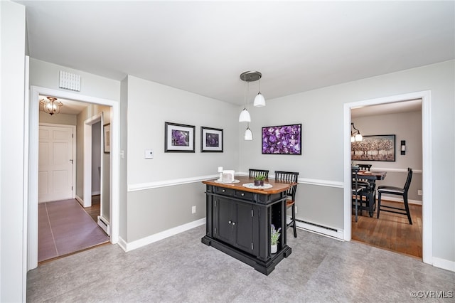 carpeted dining area with a baseboard heating unit and an inviting chandelier