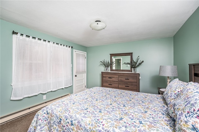 bedroom featuring baseboard heating and carpet flooring