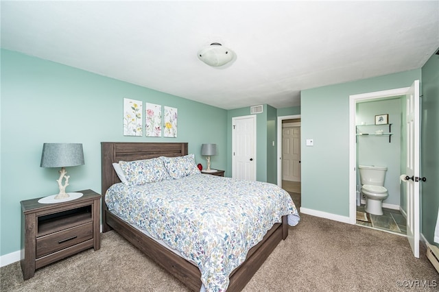 carpeted bedroom with ensuite bath