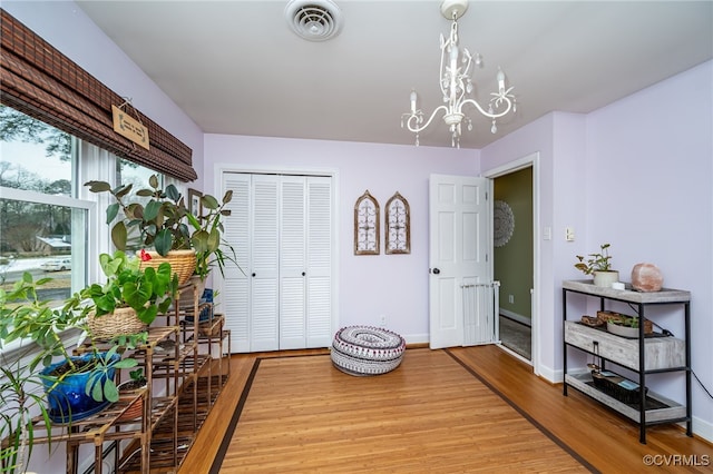 dining room featuring a chandelier and light wood-type flooring