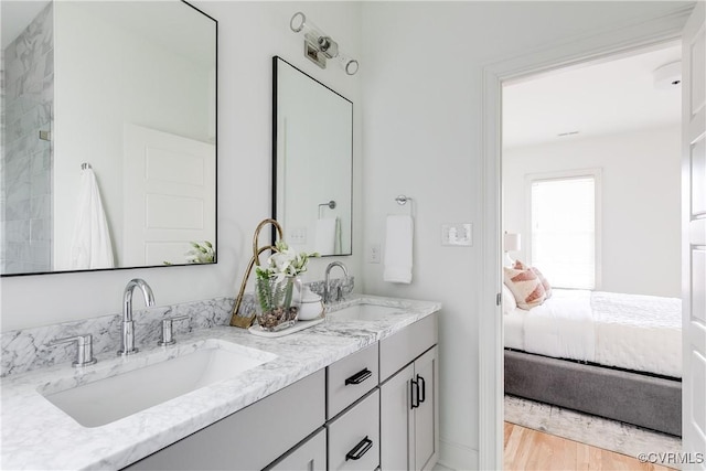 bathroom featuring vanity and hardwood / wood-style flooring