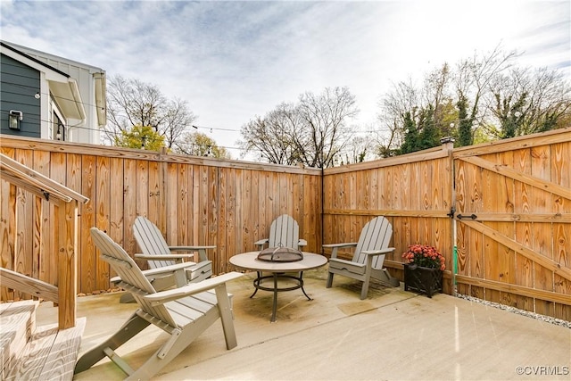 view of patio with an outdoor fire pit