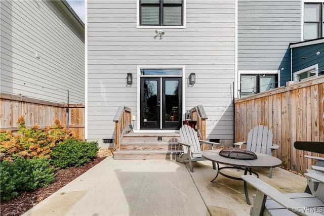 property entrance featuring a patio area