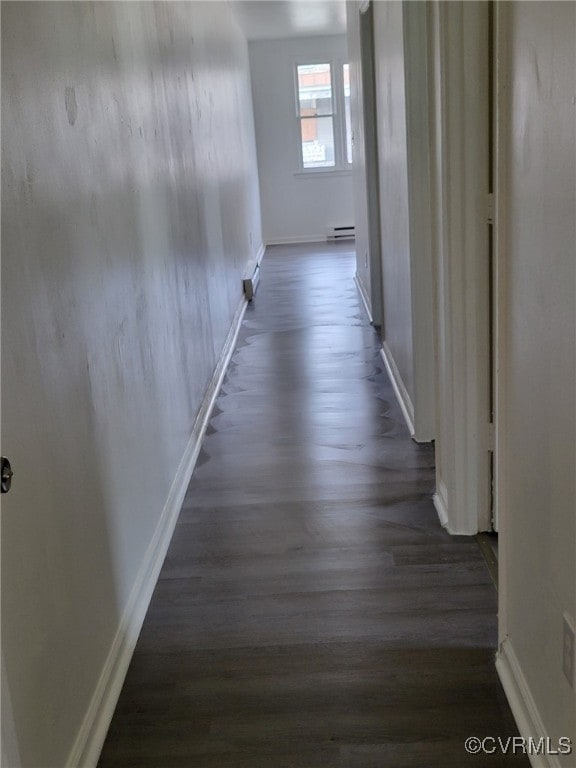 hall featuring dark hardwood / wood-style flooring and a baseboard radiator