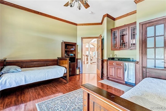 bedroom with refrigerator, ornamental molding, ceiling fan, sink, and wood-type flooring