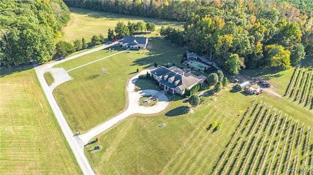 birds eye view of property with a rural view