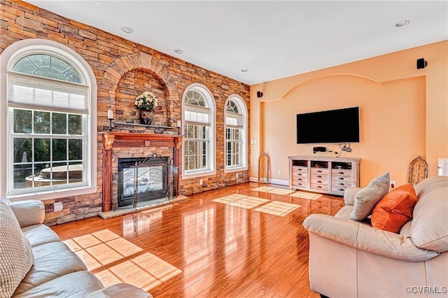 living room featuring a fireplace and light hardwood / wood-style flooring