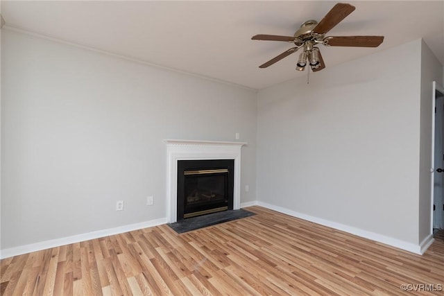 unfurnished living room featuring ceiling fan and light wood-type flooring