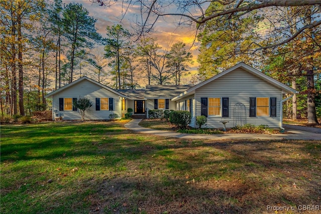 ranch-style house with a lawn