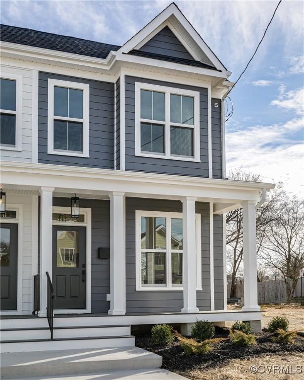 entrance to property featuring covered porch