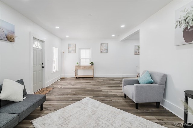 living area with hardwood / wood-style flooring