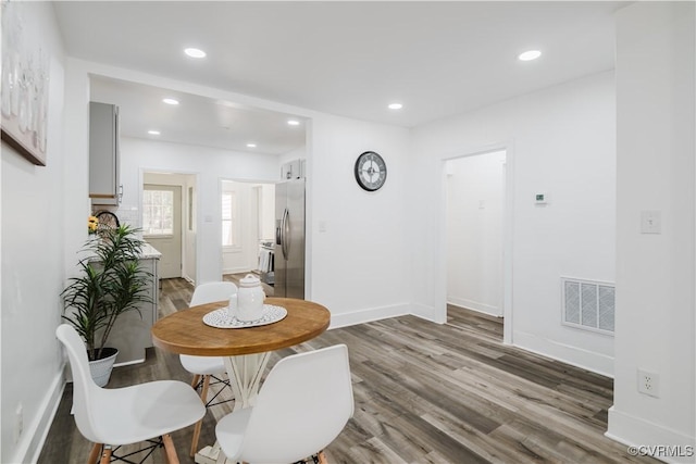 dining area with light wood-type flooring