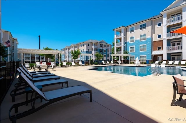 view of swimming pool with a patio area