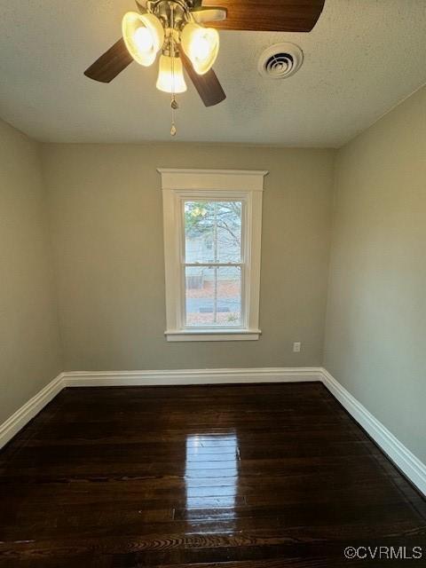 unfurnished room featuring dark wood-type flooring