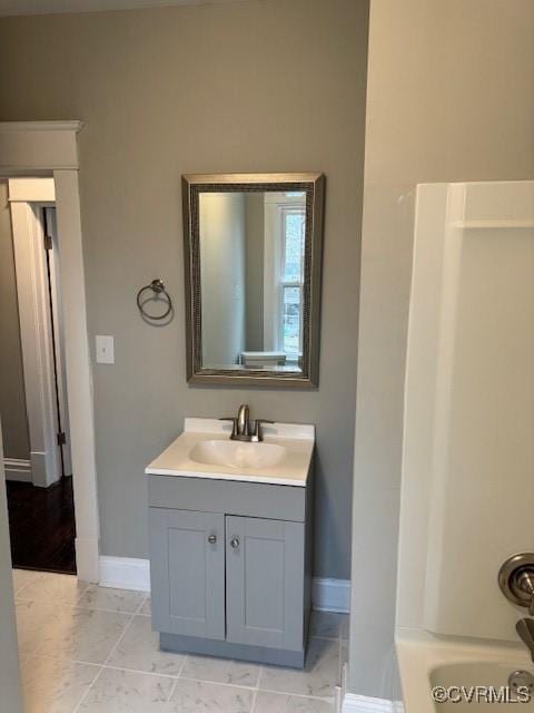 bathroom with tile patterned flooring, vanity, and bathtub / shower combination