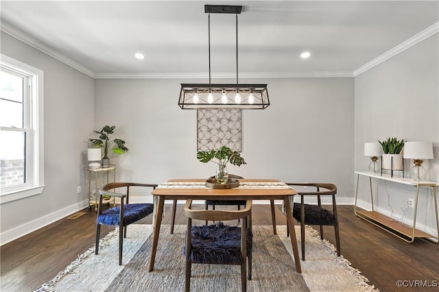 dining space with a healthy amount of sunlight, ornamental molding, and dark wood-type flooring