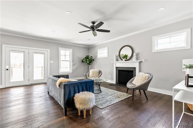 living room featuring ceiling fan, crown molding, and dark hardwood / wood-style floors