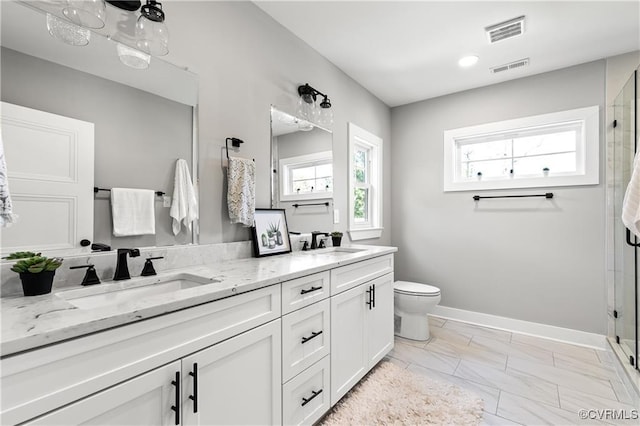 bathroom with vanity, toilet, and walk in shower