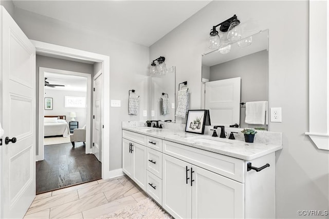 bathroom featuring ceiling fan and vanity