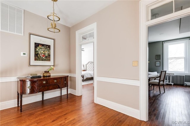 2002 Princess Anne Ave, Richmond, VA 23223 - corridor with wood finished floors and radiator heating unit