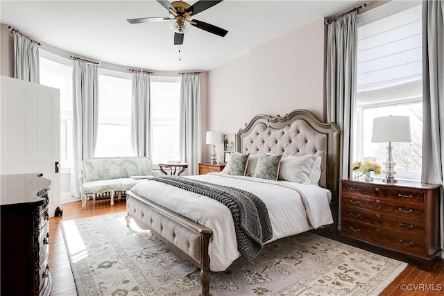 bedroom featuring wood-type flooring and ceiling fan