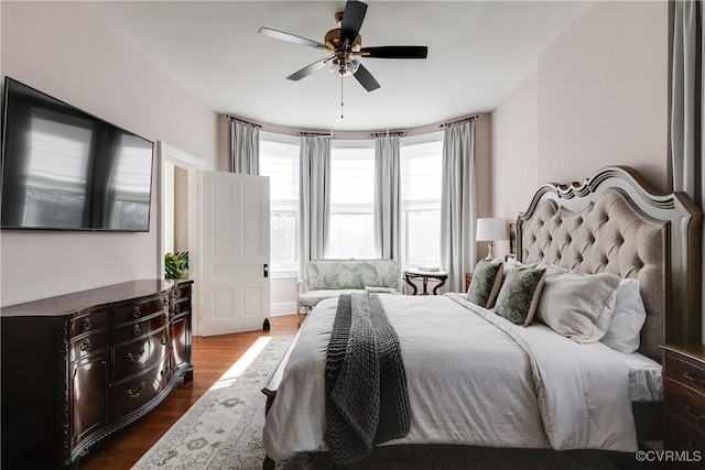 bedroom featuring dark hardwood / wood-style floors and ceiling fan