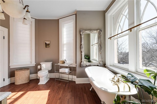 2002 Princess Anne Ave, Richmond, VA 23223 - full bathroom featuring a freestanding tub, wood finished floors, healthy amount of natural light, and crown molding