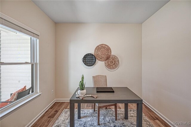 home office with wood-type flooring