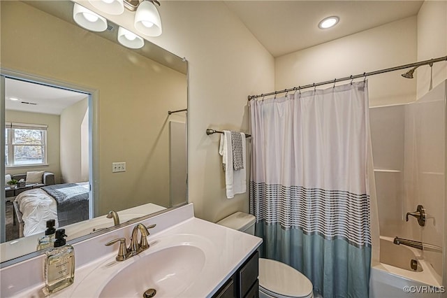 full bathroom featuring shower / tub combo, vanity, and toilet