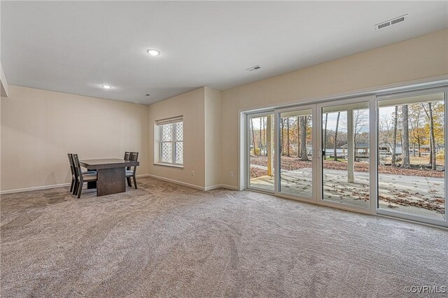 unfurnished dining area with carpet flooring