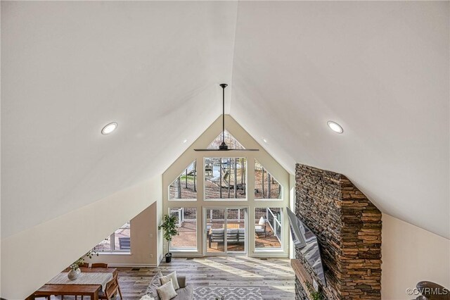 living room featuring hardwood / wood-style floors and lofted ceiling