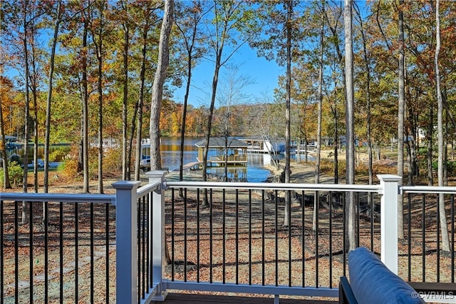 exterior space with a water view and a boat dock