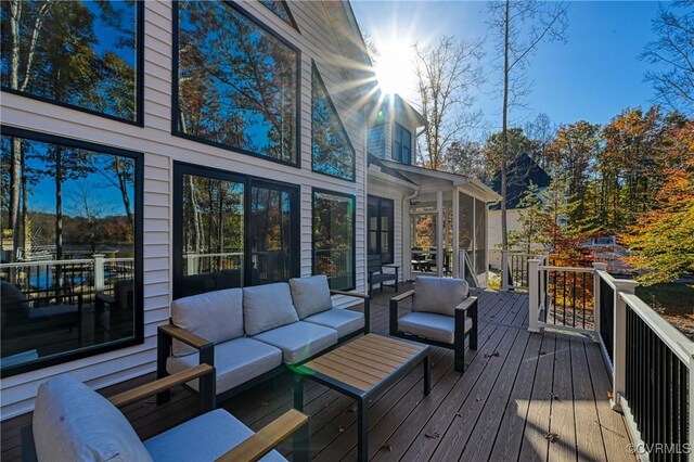 wooden terrace featuring an outdoor hangout area