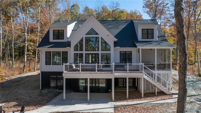 back of house featuring a carport