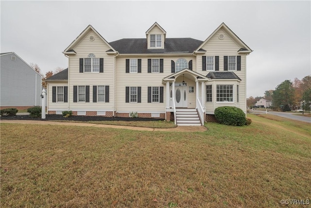 colonial inspired home with a front lawn