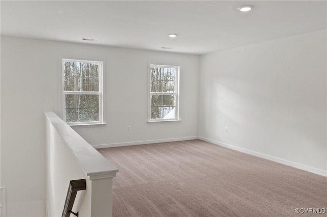 empty room with light colored carpet