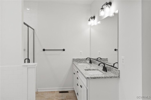 bathroom with vanity and an enclosed shower