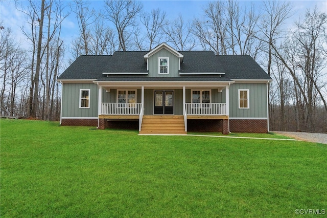 view of front of house with a porch and a front lawn