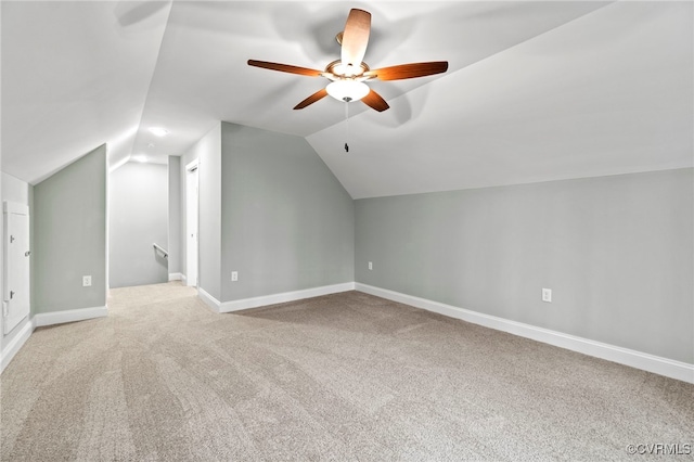 additional living space with carpet, ceiling fan, and lofted ceiling