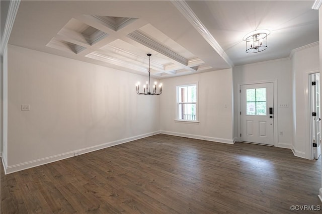 foyer entrance featuring a chandelier, ornamental molding, dark wood-type flooring, and coffered ceiling