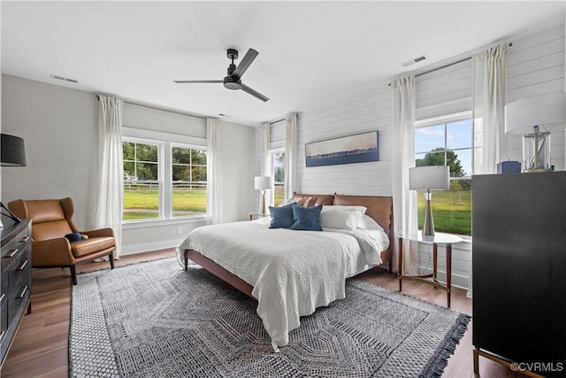 bedroom featuring hardwood / wood-style floors and ceiling fan