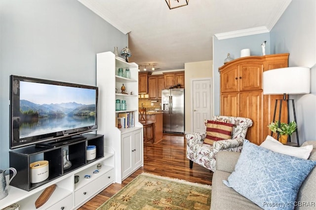 living room with wood-type flooring and crown molding